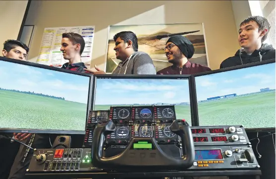  ?? ED KAISER ?? Some students are taking a brand new aviation program taught by Instructor David Williams, a flight engineer, which just started up at J. Percy Page High School in Edmonton.