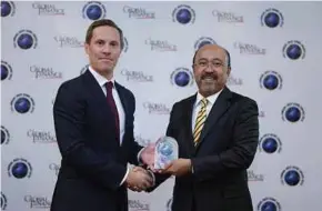  ??  ?? Maybank Islamic chief executive officer Datuk Mohamed Rafique Merican (right) and Global Finance managing director for Europe and Asia, Richard Scholtz, at the Global Finance Awards 2018 recently