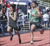  ?? Craig Weston ?? DIJON STANLEY, right, wins the 400 in 46.94 seconds, the second-best by a City runner this century.