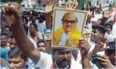  ??  ?? Dravida Munnetra Kazhagam (DMK) party supporters gather in front of the hospital in Chennai where party president M Karunanidh­i is being treated. — AFP