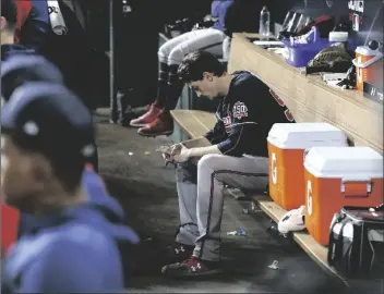  ?? CURTIS COMPTON/AP ?? BRAVES STARTER MAX FRIED SITS DEJECTED in the dugout during the 6th inning of a 7-2 loss to the Astros in game 2 of the World Series on Wednesday in Houston.