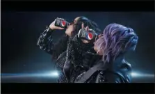  ?? PEPSICO VIA THE ASSOCIATED PRESS ?? This undated image provided by PepsiCo shows Missy Elliott, right, and H.E.R. in a scene from the company’s 2020 Super Bowl NFL football spot. Pepsi tries to reignite the Cola Wars with Missy Elliott and H.E.R. performing an updated version of “Paint it Black” that starts with a red cola can that looks like a Coke changing into a black can of Pepsi Zero Sugar to the lyrics of “I see a red door and I want it painted black.”