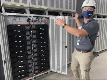  ?? PHOTOS BY JAMES HERRERA — MONTEREY HERALD ?? Vistra employee, Brad Masek, talks about the enormous lithium-ion battery system housed in Phase II of the Vistra Zero Moss Landing Energy Storage Facility on August 19, 2021.