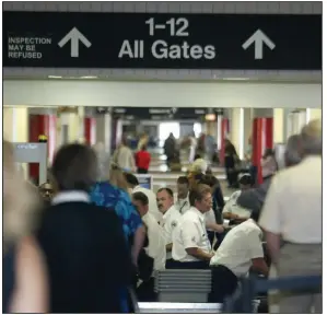  ?? (Arkansas Democrat-Gazette/Staton Breidentha­l) ?? The Sept. 11, 2001, terrorists attacks on the United States forever changed security efforts at the nation’s airports. Among the earliest changes at Bill and Hillary Clinton National Airport in Little Rock was increasing the number of federal passenger screeners.