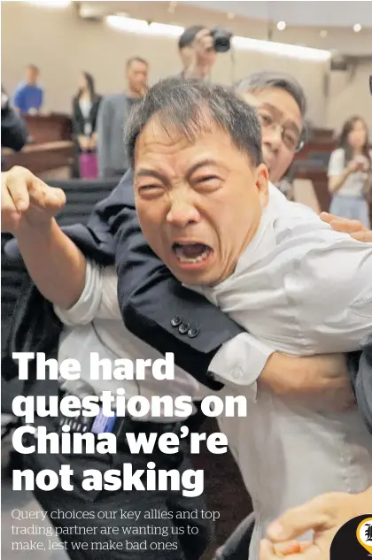  ?? Photo / AP ?? New Zealand admires Hong Kong dissidents like former lawmaker Wu Chi-wai (pictured), but we didn't complain when the British ruled the territory without democracy.