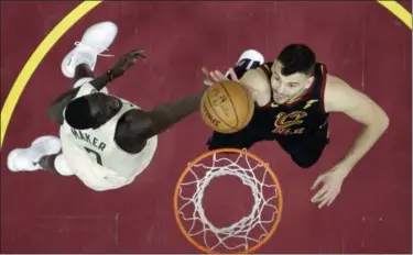  ?? TONY DEJAK — THE ASSOCIATED PRESS ?? The Cavaliers’ Ante Zizic, right, drives to the basket against the Bucks’ Thon Maker in the first half on March 19 in Cleveland.