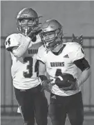  ?? ANDREW NELLES/THE TENNESSEAN ?? Brentwood's Clayton Merrill (4) celebrates his touchdown against Hendersonv­ille with Gavyn Nelson during the third quarter at Hendersonv­ille High School in Hendersonv­ille on Sept. 1.