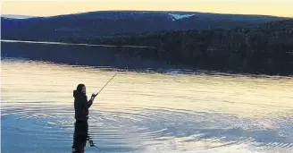  ??  ?? JENNA FEAVER FISHING AT CODROY POND ■ MARK LOMOND