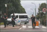  ?? AP/FRANCOIS MORI ?? A police checkpoint blocks access to the gathering Thursday in Saint-Etienne-du-Rouvray, France, honoring the Rev. Jacques Hamel, who was slain Tuesday.