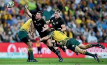  ?? PHOTO: GETTY IMAGES ?? Ryan Crotty loses the ball in contact against the Wallabies on Saturday night.