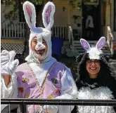  ?? Courtesy Kim Hubbeling ?? Beacon Hill resident Kim Hubbeling dresses as a skunk to help the Easter Bunny (husband, Daniel Hubbeling). The striped skunk is prevalent in the couple’s Beacon Hill neighborho­od.