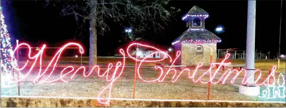  ?? TIMES photograph­s by Annette Beard ?? Merry Christmas lights shine in downtown Pea Ridge.