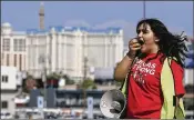  ?? ISAAC BREKKEN / ASSOCIATED PRESS ?? Volunteer Jenifer Murias yells into a megaphone as Culinary Union members file into an arena Tuesday in Las Vegas to vote on whether to authorize a strike.