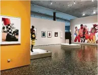  ?? Molly Glentzer / Staff ?? John Dyer’s “Selena,” above, captured the hip fashion attitude of a music icon in 1992 for
Texas Monthly. Left, one of the galleries of “Icons of Style: A Century of Fashion Photograph­y” at the Museum of Fine Arts, Houston.