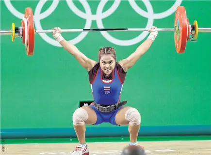  ??  ?? Weightlift­er Sopita Tanasan on her way to winning gold at the 2016 Olympics.