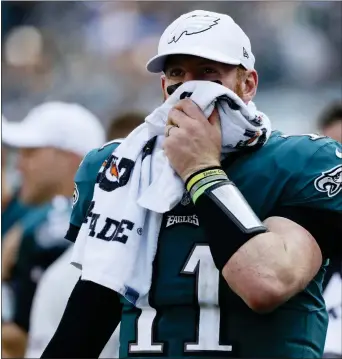  ?? ?? Eagles’ Carson Wentz looks form the sidelines during the second half of Sunday’s game against the Lions. (AP Photo/Michael Perez)