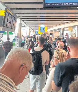  ?? Picture: PA. ?? Long queues and crowds of delayed passengers build up at Heathrow, the busiest airport in the UK.