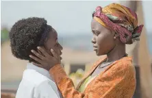  ??  ?? CHESS `QUEEN': Lupita Nyong'o, right, plays the worried mother of Phiona Mutesi (Madina Nalwange, left), a young Ugandan chess champion.