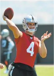  ?? KRISTOPHER SKINNER/STAFF ?? Derek Carr will be throwing the football for the Raiders for at least another five seasons after signing his extension.