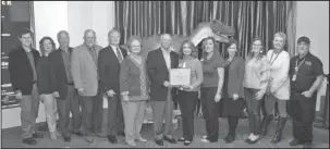  ?? The Sentinel-Record/Richard Rasmussen ?? EXHIBIT FUNDING: Oaklawn Foundation board members, from left, Ira Kleinman, Carla Mouton, Larry Stanley, Larry Stephens, Kermit Tucker, Melinda Gassaway and Dennis Smith present Mid-America Science Museum Executive Director Diane LaFollette and staff...