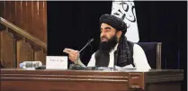  ?? Muhammad Farooq / Associated Press ?? Taliban spokesman Zabihullah Mujahid speaks during a press conference in Kabul, Afghanista­n, on Monday.