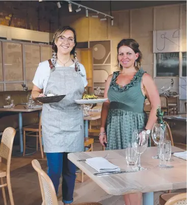  ?? Pictures: STEWART McLEAN ?? FINE DINING: Waitress Zara Layman and venue manager Angela Stayte guarantee customers will leave satisfied after a visit to Soma.