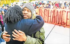  ??  ?? Corey Menafee, a Yale employee, hugs Kica Matos, director of immigrant rights and racial justice at the Center for Community Change, during a rally by a coalition of city groups and the Yale University community in Beinecke Plaza in front of Woodbridge Hall in New Haven. The groups were protesting the name of Yale’s Calhoun College and calling for its renaming. It was renamed Grace Hopper College.