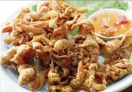  ??  ?? The deep-fried chicken skin promises to translate to instant addiction.