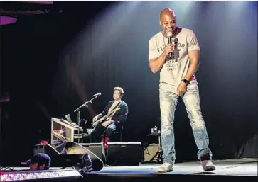  ?? Mathieu Bitton ?? COMEDIAN Dave Chappelle, right, and singer-guitarist John Mayer on Friday at the Hollywood Palladium.