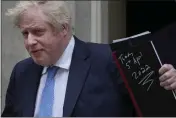  ?? ALASTAIR GRANT — THE ASSOCIATED PRESS ?? Britain’s Prime Minister Boris Johnson waves to the media as he leaves 10Downing Street in London on Tuesday.