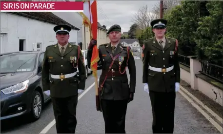  ??  ?? THE 27 Inf Bn Colour party who led the 2018 St Patrick’s day parade in Kingscourt and Cootehill, Co Cavan. 27 Inf Bn RDF have members from Monaghan, Cavan and Louth. Lt McCabe pictured here is an Army Reserve officer with the 27 Inf Bn and also teaches...