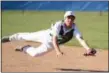  ?? BARRY BOOHER — THE NEWS-HERALD ?? Lake Catholic’s Andrew Druzina dives for a ground ball May 1 at NDCL. The Cougars won, 4-3.