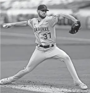  ??  ?? Brewers starting pitcher Adrian Houser had trouble in the shortened-2020 season, finishing with a 5.30 ERA in 12 outings.