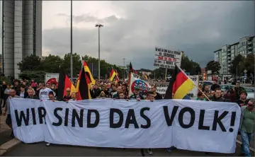  ??  ?? Members of the right-wing populist ‘Pro Chemnitz’ movement march through the streets of Chemnitz. — AFP photo