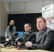  ?? Colleen De Neve/calgary Herald ?? Rocky View Schools Superinten­dent Greg Bass, right, and RCMP Cpl. Darrin Turnbull discuss the school accident.