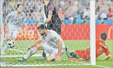  ??  ?? Spain’s Diego Costa scores a goal against Portugal at the Fisht Stadium in Sochi. — AFP photo