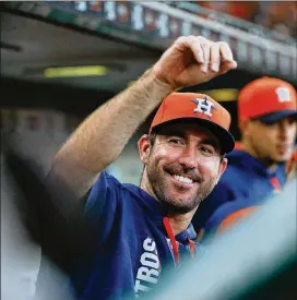  ?? BOB LEVEY / GETTY IMAGES ?? New Houston Astros pitcher Justin Verlander waves to a fan at Minute Maid Park. The American League-leading Astros acquired Verlander, a former MVP and Cy Young Award winner, from the Detroit Tigers in a trade last Thursday.