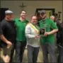  ?? GARY PULEO — DIGITAL FIRST MEDIA ?? Irish coffee contest judge Tommy O’Donnell awards the plaque for first place to the Norristown Maenner Chor Club on Thursday. From left are Maenner Chor Club President Jim McMonigle, Dan McMonigle, O’Donnell and Stephen McMonigle.