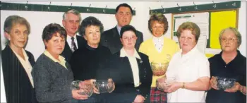  ??  ?? Margot Farrell, from Castletown­roche (third right), captain of the ladies team that won the final of the winter league played at Doneraile golf course in March 2000. Other members of the team (holding trophies) are, l-r: Beatrice Hill, Kate Walsh, Sheila O’Keeffe and Mona Costelloe. Also present are, on the left, lady president Evelyn O’Sullivan, along with lady captain, Margaret McAuliffe, Jimmy O’Leary, captain of Doneraile Golf Club and Pat Owens, Hibernian Hotel, Mallow (event sponsor).