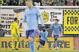  ?? [ADAM CAIRNS/DISPATCH] ?? David Villa, right, pumps his fist after scoring New York City FC’s only goal against Crew SC on Tuesday. Villa has scored in each of his past five appearance­s against the Crew, including playoff games.