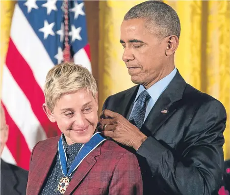  ??  ?? PRESIDENT Barack Obama paid tribute to comedian Ellen DeGeneres as he awarded her the United States’ highest civilian honour.
He honoured 21 people with the Presidenti­al Medal of Freedom at the White House, including actors Tom Hanks, Robert De Niro,...