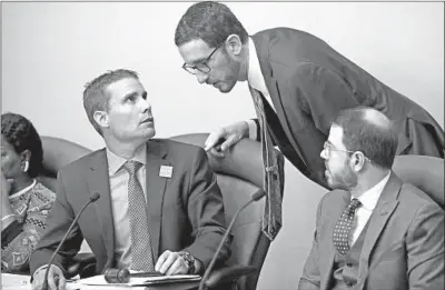  ?? Rich Pedroncell­i Associated Press ?? STATE SENS. Mike McGuire, left, and Scott Wiener confer in a Wednesday committee hearing. After the two reached an agreement on limiting the effect of Wiener’s Senate Bill 50 on smaller counties, McGuire dropped his competing bill.