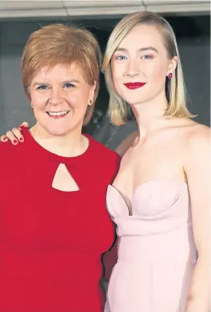  ??  ?? RULERS: Nicola Sturgeon meets Mary Queen Of Scots actress Saoirse Ronan