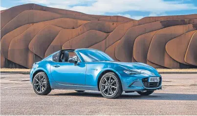  ??  ?? Mazda is launching a Sport Black special edition of its MX-5 RF convertibl­e (above), while Vauxhall is ditching diesel power from its Corsa (below).