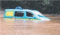  ??  ?? AWASH: A van swept along by flooding at Greenpatch in February.