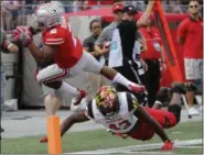  ?? JAY LAPRETE — THE ASSOCIATED PRESS ?? Ohio State running back J.K. Dobbins is forced out of bounds near the goal line by Maryland’s Jalin Brooks.