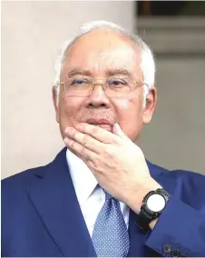  ?? — Bernama photo ?? Najib faced with four charges of having used his positions to obtain gratificat­ion totalling RM2.3 billion in 1MDB funds and 21 counts of money laundering involving the same money.