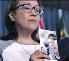  ?? CANADIAN PRESS FILES ?? Debbie Baptiste, mother of Colten Boushie, holds a photo of her son during a press conference on Parliament Hill in Ottawa in February.