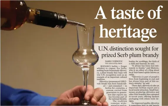  ?? (AP/Darko Vojinovic) ?? A bartender pours plum brandy into a glass Nov. 11 in Belgrade, Serbia.