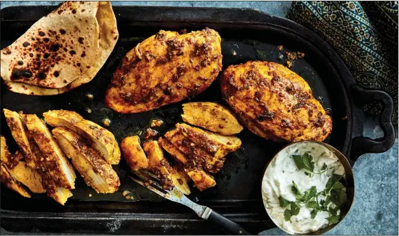  ?? (The New York Times/Romulo Yanes) ?? Priya Krishna’s Garlic-Ginger Chicken Breasts With Cilantro and Mint